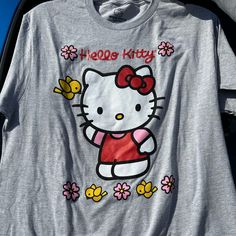 Hello Kitty By Sanrio T-Shirt Size Large Brand New Fun Hello Kitty Short Sleeve Tops, Cotton Hello Kitty Fun Tops, Fun Cotton Tops With Hello Kitty, Fun Hello Kitty Print Summer T-shirt, Playful Hello Kitty T-shirt For Spring, Hello Kitty Kawaii T-shirt For Spring, Hello Kitty Fun Crew Neck Top, Hello Kitty Crew Neck Fun Tops, Kawaii Hello Kitty T-shirt For Spring