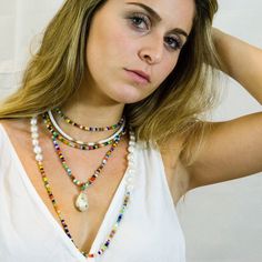 "Bright, vibrant beads make this necklace perfect addition to your summer sundress or a white blouse. African glass beads and white freshwater pearls are hand knotted along the silk cord to create a colorful and bright strand. Alone or layered with your favorites, this necklace exudes a playful, eclectic bohemian elegance. Necklace: 43\" Layer this necklace with: https://www.etsy.com/listing/637252353/baroque-pearl-and-turquoise-necklace?ref=shop_home_active_2 You might also like: https://www.et Handmade White Pearl Shell Necklace, Summer Multi-strand Colorful Beaded Necklaces, White Shell Necklace With Pearl Charm For Vacation, White Necklace For Festivals, Summer Bohemian Gemstone Beads, White Pearl Beach Jewelry, White Pearl Jewelry For Beach, White Pearl Jewelry For The Beach, Multicolor Summer Jewelry