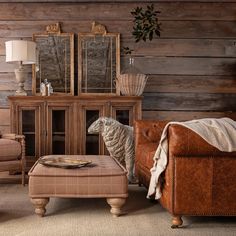 a living room filled with furniture and a sheep statue