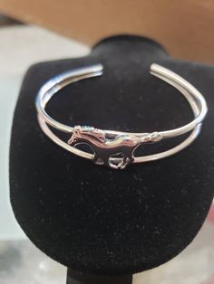 *Horse Cuff *Sterling Silver *Free Shipping *Handcrafted In USA *Jewelry ship in Gift box Thank You For Your Looking ,And Check Out More Items In My Etsy Shop For More Deals, Also We Add More Jewelry To Etsy Shop Regularly https://www.etsy.com/shop/LIZturquoise Adjustable Silver Jewelry For Shows, Adjustable Sterling Silver Horse Design Jewelry, Formal Sterling Silver Jewelry With Horse Design, Formal Silver Jewelry With Horse Design, Adjustable Horse Design Bracelet, Silver Sterling Silver Jewelry For Shows, Silver Horse Design Bracelet Gift, Silver Bracelet With Horse Design For Gift, Silver Horse Design Bracelet Jewelry