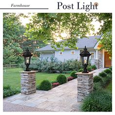 the front cover of a magazine with two lamps on top of stone pillars in front of a