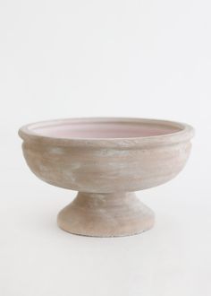 a white bowl sitting on top of a table