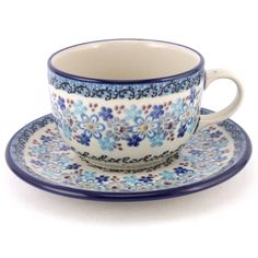 a blue and white coffee cup with saucer