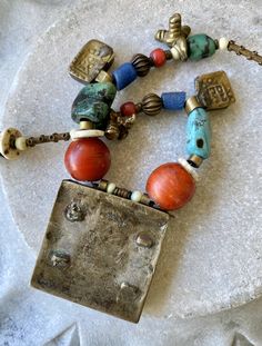 Ethnographic Antique Amulet Prayer Box Glass Brass Mixed Stone Turquoise Wood Trbal Bead Necklace measures 22 inches around weighs 3.4 oz. Traditional Rectangular Necklace For Festivals, Traditional Adjustable Rectangular Necklaces, Traditional Adjustable Rectangular Necklace, Traditional Multicolor Rectangular Necklace, Bohemian Multicolor Rectangular Jewelry, Amulet Necklaces With Large Beads For Rituals, Traditional Rectangular Jewelry With Colorful Beads, Artisan Turquoise Necklace With Large Beads As A Gift, Traditional Beaded Rectangular Necklaces