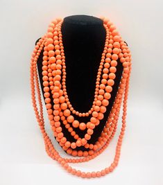 Fabulous large chunky multi strand faux coral necklace. 7 strands of Lucite beads in many different sizes and lengths. The shortest strand (closest to the neck) measures 21 inches long including extender chain and the longest strand (farthest from the neck) is 35 inches long including extender. Has secure clasp. Perfect for summer. In excellent vintage condition with minimal age appropriate wear. Coral Beads Necklace, Vintage Designer Jewelry, Necklace Layered, Coral Necklace, Coral Beads, Multi Strand Necklace, Vintage Designer, Strand Necklace, Designer Jewelry