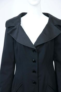 For Sale on 1stDibs - Jean Louis Scherrer classic black coatdress with tuxedo detailing in its taffeta spread collar and four-button wrists. The body is shaped with front and Classic Evening Blazer With Button Closure, Tuxedo Suit With Button Closure For Evening, Evening Suits With Button Closure And Suit Collar, Timeless Fitted Formal Blazer Dress, Timeless Fitted Blazer Dress For Formal Occasions, Evening Tuxedo Suit With Button Closure, Classic Black Blazer Dress For Business, Fitted Blazer Dress With Button Closure For Evening, Black Single Breasted Blazer Dress For Evening