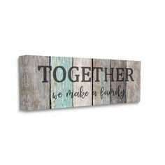 a wooden sign that says together we make family