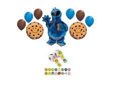 a cookie monster balloon with balloons and stickers on the ground next to it's contents