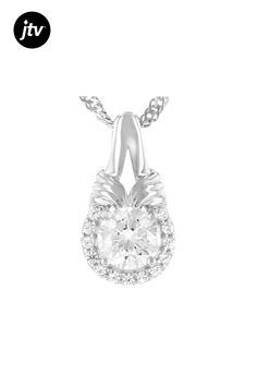 1.10ct 6mm round Lab Created Strontium Titanate and .13ctw 1.25mm round white zircon rhodium over sterling silver pendant with chain. Measures approximately .64"L x .35"W.  Chain has lobster claw closure with 2-inch extender. 2mm bail. Color may vary Accent stones primarily zircon. Diamond White Necklace With Halo Setting And Round Stone, Diamond White Round Pendant Jewelry With Center Stone, Anniversary Necklace With Round Center Stone, Diamond White Jewelry With Center Stone Round Pendant, White Gold Necklaces With Center Stone For Anniversary, Anniversary Cubic Zirconia Necklace With Center Stone, White Sterling Silver Diamond Necklace With Halo Setting, White Diamond Halo Necklace In Sterling Silver, White Diamond Necklace With Halo Setting In Sterling Silver