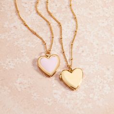 Fall in love with this golden locket that's shaped like a heart. Get lost in the timeless style of the Isla Heart Locket, sure to be your newest accessory crush. Perfect for wearing your heart outside your chest. Available in 14k gold plated brass Pendant size: 5/8" by 3/4" 16" satellite chain with 2" extender Lobster claw closure Water resistant and protective anti-tarnish barrier SKU: BYN1435 Dainty Heart Necklace With Locket, Gold Plated Heart Necklace With Charms, Heart Locket Necklace Gift For Her, Dainty Heart Shaped Locket Necklace With Charm, Dainty Double Heart Locket Necklace With Charm, Dainty Gold-tone Heart Jewelry, Heart Shaped Tarnish Resistant Bracelet For Gift, Heart Pendant Locket Necklace As Gift For Her, Gold Plated Heart Charm Locket Necklace Gift