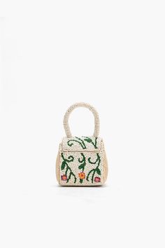 Embrace the joy of everyday adventures with our Little Flower Fun Mini Bag—an enchanting accessory designed to infuse your style with a burst of playful elegance. This mini bag is a celebration of floral charm, offering a delightful combination of whimsy and sophistication. Mini Clutch Magnetic Flap Closure Fully Beaded Front and Back Round Beaded Handle Made in Cotton Size : 3.5" x 3" x 2.5" Feminine Shoulder Bag For Spring Gift, Spring Gift Bag With Detachable Strap, Spring Gift Bag With Detachable Handle, Spring Gift Bags With Detachable Strap, Spring Gift Bags With Detachable Handle, Chic Flower-shaped Bag For Daily Use, Small Bags With Detachable Handle For Everyday Use, Chic Flower-shaped Bags For Spring, Chic Flower-shaped Shoulder Bag For Everyday Use