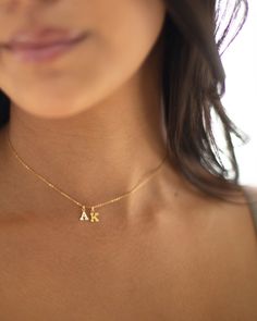 Mini initial necklace, perfect for adding a personal touch to any outfit. Dainty Initial Necklace - Perfect wearing alone or layering with your favorite necklaces. Super dainty & fun. Each initial measures approx. 6X8mm, You can add up to 5 Initials. Available in 14k Yellow Gold filled or sterling silver. --------------------------------------- SHIPPING UPGRADES You can find shipping upgrades options in the drop bar menu when you check out. + Within the U.S Regular First-class : 2-6 business 2 Initial Necklace, Simple Charm Necklace With Initial Pendant, Dainty Clavicle Chain Necklace For Personalized Gift, Dainty Name Necklace With Delicate Chain For Her, Personalized Dainty Clavicle Chain Necklace, Dainty Initial Pendant Charm Necklace For Gift, Dainty Initial Pendant Charm Necklace As Gift, Dainty Charm Necklace With Initial Pendant As A Gift, Personalized Gift Charm Necklace With Delicate Chain