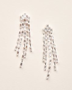 It's all in the name of our Cascade Statement Earrings. Designed with linked CZ baguettes that dangle in the perfect cascading statement earring. Lightweight for long wear. Cubic zirconias 2.5" length x 0.5" width Hypoallergenic, lead-free & nickel-free Style #4375 Luxury Dangle Linear Earrings As Gift, Luxury Silver Linear Earrings, Luxury Silver Glamorous Linear Earrings, Luxury Glamorous Silver Linear Earrings, Luxury Modern Linear Earrings For Wedding, Luxury Linear Drop Earrings For Formal Occasions, Luxury Sterling Silver Dangle Linear Earrings, Silver Statement Earrings, Prom Earrings