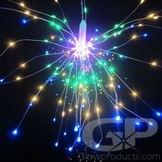 fireworks are lit up in the night sky with multicolored lights all around them