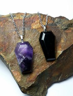 These gorgeous gemstone coffins hang from stainless steel chains. Your choice of purple amethyst or solid black obsidian. Your necklace will arrive in a small box perfect for gifting. *Each stone is unique and the one you receive will vary from the photo. Goth Necklace, Dark Wedding, Crystal Pyramid, Goth Jewelry, Witchy Jewelry, Black Obsidian, Men's Necklace, Jewelry Inspo, Steel Chain