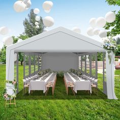 a white tent set up with tables and chairs for an outdoor wedding or party in the grass