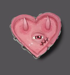 a pink heart shaped object with horns and eyeballs on it's side, in the shape of a devil