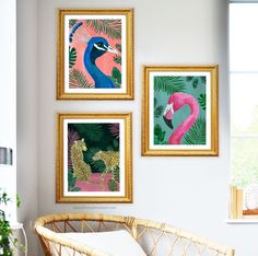 three framed pictures hang on the wall above a wicker couch