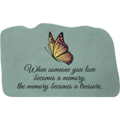 a stone with a butterfly on it that says, when someone you love becomes memory the memory