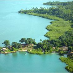 an island surrounded by trees and water