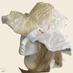 "Add a touch of vintage charm to your outdoor adventures with this upcycled vintage lace bucket hat for women. Perfect for the shabby chic cottage core bride or as a stylish honeymoon accessory, this hat also doubles as the ideal beach or sun hat. Stay cute and protected from the sun with this unique and versatile piece that is sure to turn heads wherever you go. Handcrafted with love and attention to detail, this hat is a must-have for anyone looking to add a touch of coquette nostalgia to thei Vintage Mini Bucket Hat For Kentucky Derby, Vintage Mini Hats For Spring Festivals, Vintage Hats For Kentucky Derby Festival, Adjustable Vintage Mini Hats For Festivals, White Bohemian Hat For Garden Party, Bohemian Mini Hat With Short Brim For Wedding, Vintage Adjustable Mini Hats For Festivals, Vintage Brimmed Mini Hats For Festivals, Vintage Adjustable Mini Bucket Hat