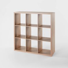 an empty wooden shelf with several compartments