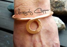 This simple, yet elegant copper cuff bracelet is completely hand crafted from copper wire, hand hammered, and is available in a brushed, polished, or antiqued finish. (select your desired finish from the drop down menu) It is an absolute favorite of mine!! I often pair this circle drop bracelet, for a layered and stacked look, with my three piece copper bracelets set found here: https://www.etsy.com/listing/499787894/copper-bracelets-copper-bangle-twisted Available in sizes 5 - 8 1/2 (select des Copper Jewelry Diy, Handmade Copper Bracelet, Big Bracelets, Copper Bracelets, Hammered Jewelry, Copper Anniversary, Copper Jewelry Handmade, Bijoux Fil Aluminium, Copper Diy