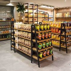 a grocery store filled with lots of food and condiments on wooden shelving