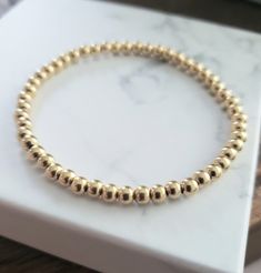 4mm gold filled delicate ball bead bracelet, expandable  one size fits most. Adjustable Gold Stretch Bracelet Stackable, Adjustable Gold Stretch Bracelet For Everyday, Adjustable Stackable Gold Stretch Bracelet, Adjustable Gold Stretch Bracelet With Tiny Beads, Adjustable Gold Bracelet For Everyday, Minimalist Hypoallergenic Beaded Round Bracelets, Minimalist Hypoallergenic Round Beaded Bracelets, Stackable Round Stretch Bracelet, Minimalist Hypoallergenic Beaded Bracelet