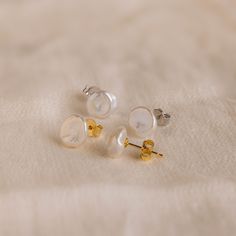 Exquisite in simplicity, our Freshwater Pearl Studs add a touch of refined charm to any occasion. Ideal for formal events or as a heartfelt Mother's Day surprise, these pearl earrings exude timeless elegance for every moment 🤍✨ SKU: RR-ER472 Product Details Material: High Quality Solid 925 Sterling Silver Finish: 18K Gold ∙ Sterling Silver Featuring Freshwater Pearl Stud Earrings, Pearls ranging from ~9-11mm Sold as a Pair Featured Styles Part of our Pearl Collection Model showcases an elegant, Timeless Round Pearl Earrings For Everyday, Minimalist Round Pearl White Earrings, Elegant Pearl White Everyday Earrings, Elegant Everyday Pearl White Earrings, Elegant Everyday Pearl White Pearl Earrings, Classic Pearl White Jewelry With Pearl Buttons, Refined Round Pearl Earrings As Gift, Refined Round Pearl Earrings For Gift, Formal Minimalist Pearl Earrings With Charm