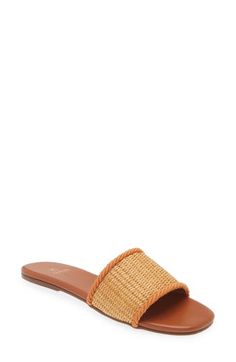 A woven raffia vamp enhances the sunny-day appeal of a minimalist slide sandal lined in soft leather and grounded by a slim rubber sole. Synthetic and textile upper/leather lining/rubber sole Imported Hispanic & Latinx Owned/Founded Spring Beach Sandals With Woven Leather, Spring Vacation Sandals With Woven Leather, Summer Sandals With Textured Sole And Straw Material, Natural Color Sandals With Woven Sole For Spring, Brown Straw Slip-on Sandals, Straw Open Toe Slides With Textured Footbed, Straw Slides With Textured Footbed And Open Toe, Brown Straw Sandals For Spring, Flat Woven Leather Sandals For Spring