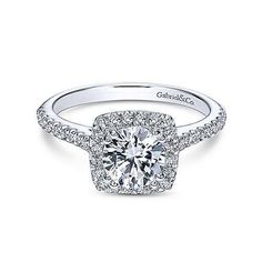 an 18k white gold cushion shaped halo diamond engagement ring