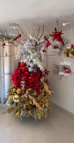 a decorated christmas tree in a living room with ornaments hanging from it's sides