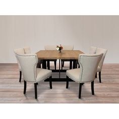 a dining room table and chairs with white upholstered chairs on the bottom row