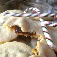 several pastries with candy canes in the background