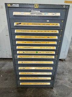 a large metal cabinet with many yellow and black labels