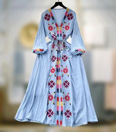 Embrace the spring-summer charm with this French sweet dress. Featuring a V-neck, delicate embroidery, drawstring waist, and a wide swing silhouette for a retro ethnic allure. One size: Length 48.4 inches (123 cm) Bust 38.6 inches (98 cm) Sleeve 18.1 inches (46 cm) Waist 34.6 inches (88 cm) **Additional Notes** - Production Variance: There may be a deviation of 0.39-1.18 inches (1-3 cm) due to different production batches. Please allow for this variability. - Size Comparison: If you are unsure a Traditional V-neck Boho Dress For Spring, Spring Festival Embroidered V-neck Dress, Bohemian Maxi Dress With Tie Waist, Spring V-neck Embroidered Dress With Geometric Design, Spring V-neck Embroidered Dress With Geometric Embroidery, Bohemian Drawstring Maxi Dress For Summer, V-neck Embroidered Dress With Geometric Patterns For Spring, Spring V-neck Dress With Geometric Embroidery, Spring V-neck Maxi Dress With Multicolor Embroidery