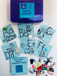 an animal alphabet game is shown in front of it's contents