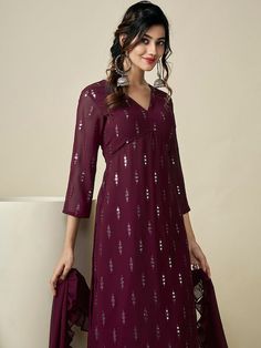 Burgundy embroidered Kurta with Palazzos with dupattaKurta design:Ethnic motifs embroideredA-line shapeRegular styleV-neck, three-quarter regular sleevesNa pockets sequinned detailKnee length length with straight hemGeorgette machine weave fabricPalazzos design:Solid PalazzosPartially elasticated waistbandSlip-on closure V-neck Anarkali Set For Diwali, Elegant V-neck Kurta For Festive Occasions, Georgette V-neck Sets For Navratri, V-neck Georgette Sets For Navratri, Eid V-neck Sets With Zari Work, V-neck Traditional Wear With Zari Work For Diwali, V-neck Traditional Wear With Dabka Work For Diwali, V-neck Dabka Work Traditional Wear For Diwali, Georgette V-neck Designer Wear Sets