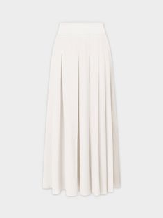 Experience effortless style with our Yolk Pleated Skirt in a classic white hue. The 37" length provides elegant coverage, while the pleated design adds texture to your look. Elegant Relaxed Skirt For Daywear, Flowy Flared Pleated Skirt For Daywear, Elegant Solid Color Maxi Skirt For Daywear, Classic Lined Skirt For Daywear, Classic Flowy Skirt, Elegant Pleated Bottoms For Daywear, Elegant Daywear Bottoms With Pleated Waist, Elegant Pleated Waist Bottoms For Daywear, Classic A-line Skirt For Daywear