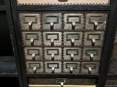 an old wooden drawer with metal handles