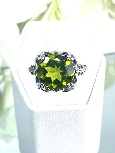 Natural or Simulated Green Peridot Ring  Speechless Design#103 MADE TO ORDER Inspired by Victorian era filigree designs, I now offer this stunning Antique inspired ring in sterling silver. This fabulous ring is set with a 6ct stunning green peridot gemstone (Simulated or Natural gemstone options). The round full cut high-quality AAA gemstone is 12mm (just shy of 1/2th of an inch) in diameter, and has very good color and clarity. The inside of the band is marked 925 for sterling silver. Notice th Classic Peridot Jewelry With Accent Stones, Classic Peridot Jewelry With Prong Setting, Classic Peridot Ring Jewelry, Classic Peridot Green Rings, Classic Green Peridot Ring, Classic Peridot Solitaire Jewelry, Classic Solitaire Peridot Jewelry, Classic Peridot Ring, Classic Green Jewelry With Vs Clarity