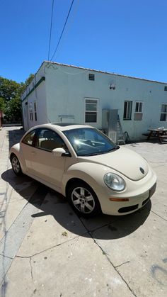 a white car parked in front of a building