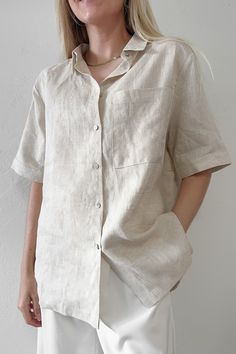 The Nantucket Linen Button Down Shirt in Natural is a perfect shirt to throw over a tank top during the day or wear buttoned at night! Featuring an oversized fit, linen fabric, button down front, natural color, and a front pocket. Style over a basic bot with breezy cotton bottoms! Details & Sizing Oversized fit Linen fabric Functional buttons Natural color Front Pocket Gabriella is wearing a size S Fabric 100% Linen Shipping & Returns THIS CLEARANCE ITEM IS FINAL SALE We offer $5 flat rate stand Beige Linen Button-up Shirt, Neutral Collared Shirt For Everyday, Everyday Neutral Collared Shirt, Everyday Beige Shirt With Buttons, Spring Button-up Flax Tops, Classic Beige Tops For Beach, Classic Beige Top For Beach, Classic Beige Tops For The Beach, Classic Beige Beach Top