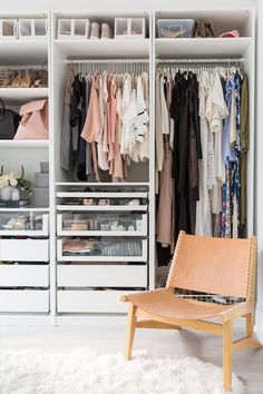 a white closet filled with lots of clothes