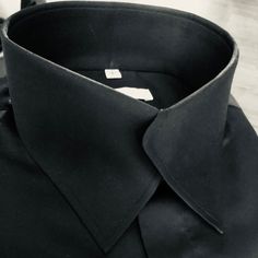 The Morcouture Black Swerve Collar Shirt. 100% Cotton, French Cuffs, Hidden Placket. A Beautiful New Addition To The Morcouture Line. Highly Stylish And Unique. Can Also Be Made In Any Color(Inquire 908 510-5882). From Black Tie Formal To Casual Chic .. The Perfect Neat, No Tie Button Up Collar Shirt. A Definite Head Turner. Shirt Is Full Regular Fit. Designer Formal Tops With Lapel Collar, Luxury Shirt With Lapel Collar For Formal Events, Luxury Shirt With Lapel Collar For Formal Occasions, Luxury Formal Shirt With Lapel Collar, Designer Fitted Collared Dress Shirt, Designer Black Shirt For Business, Designer Fitted Blouse With Collar, Designer Fitted Tops For Business, Black Business Shirt With Concealed Placket