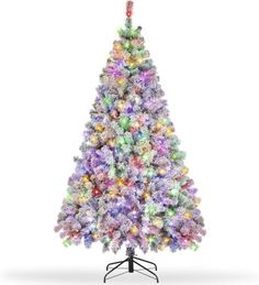 a multicolored christmas tree with lights on it's base and a white background