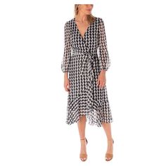 You're sure to love the look and feel of this stylish women's Maison Tara houndstooth printed wrap midi dress.Click on this WOMEN'S GUIDE to find the perfect fit and more! You're sure to love the look and feel of this stylish women's Maison Tara houndstooth printed wrap midi dress. Click on this WOMEN'S GUIDE to find the perfect fit and more! FEATURES Surplice neckline Zipper back 3/4-length balloon sleeves Elastic cuffs Partial elastic waistband with coordinating sash Ruffled hem Faux-wrap silh Elegant Spring Midi Dress With Houndstooth Pattern, Elegant Midi Dress With Houndstooth Pattern For Spring, Elegant Houndstooth Midi Dress For Spring, Knee-length Houndstooth Midi Dress, Chic Houndstooth Pattern Midi Dress For Work, Elegant Houndstooth Midi Dress For Work, Chic Houndstooth Midi Dress For Work, Elegant Knee-length Houndstooth Midi Dress, Workwear Midi-length Dresses With Houndstooth Pattern