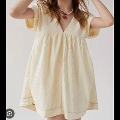 Cream Babydoll Dress From Urban Outfitters Never Been Worn Brand New With Tags! Size Xl No Trades Cream Cotton V-neck Mini Dress, Cute Beige Mini Dress With Short Sleeves, Cute Beige Short Sleeve Mini Dress, Beige Short Sleeve Summer Mini Dress, Cute Beige Cotton Mini Dress, Cute Beige Mini Dress For The Beach, Cute Beige Mini Dress For Vacation, Cream Short Sleeve Mini Dress For Daywear, Beige Summer Mini Dress For Daywear