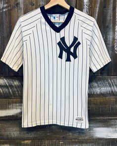 "Vintage NY Yankees Sand Knit Shirt. Like the one 2Pac wore in \"Nothing but Trouble\"! It's a size small and fits tight with a stretchy feel to it. Measures 16.5\"x26\", best for xs/s I would say but please refer to measurements for best fit. Check out v__asinvintage on IG for more!" Fitted Moisture-wicking Crew Neck Jersey, Streetwear Fan Apparel Jersey With Short Sleeves, White Crew Neck Jersey With Graphic Print, Casual White Short Sleeve Jersey, White Short Sleeve Casual Jersey, Jersey Crew Neck Top With Letter Print, Fitted Jersey With Graphic Print And Crew Neck, Fitted Crew Neck Jersey With Graphic Print, Fitted Graphic Print Crew Neck Jersey